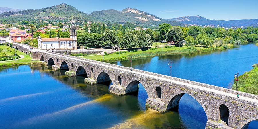 An elevated view of the beautiful medieval bridge crossing the River Lima, Portugal. 