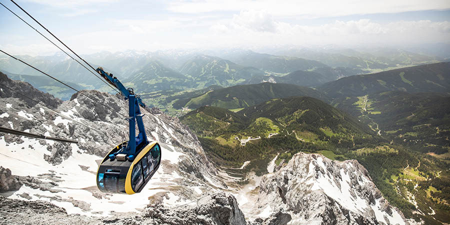 Admiring panoramic views on the Glacier 3000 cable car