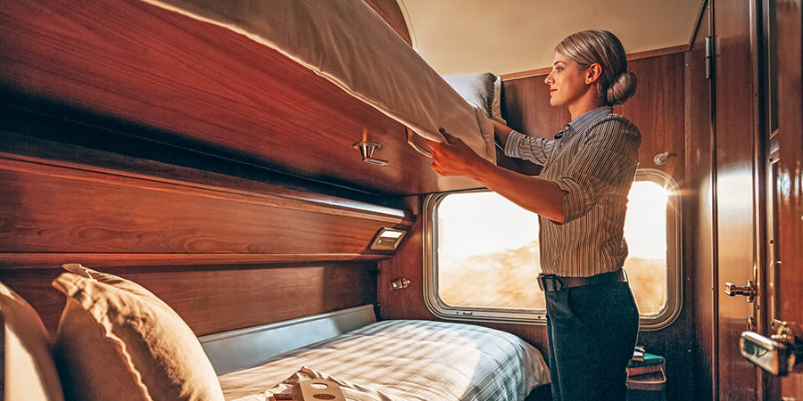 Train attendant makes bed on board the Indian Pacific train. 