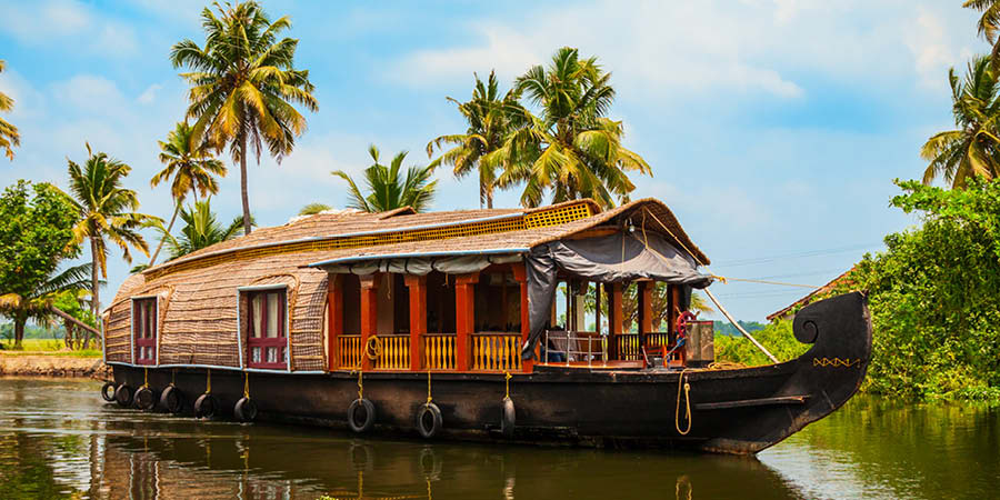 Cruising through Kerala’s idyllic backwaters on a traditional houseboat